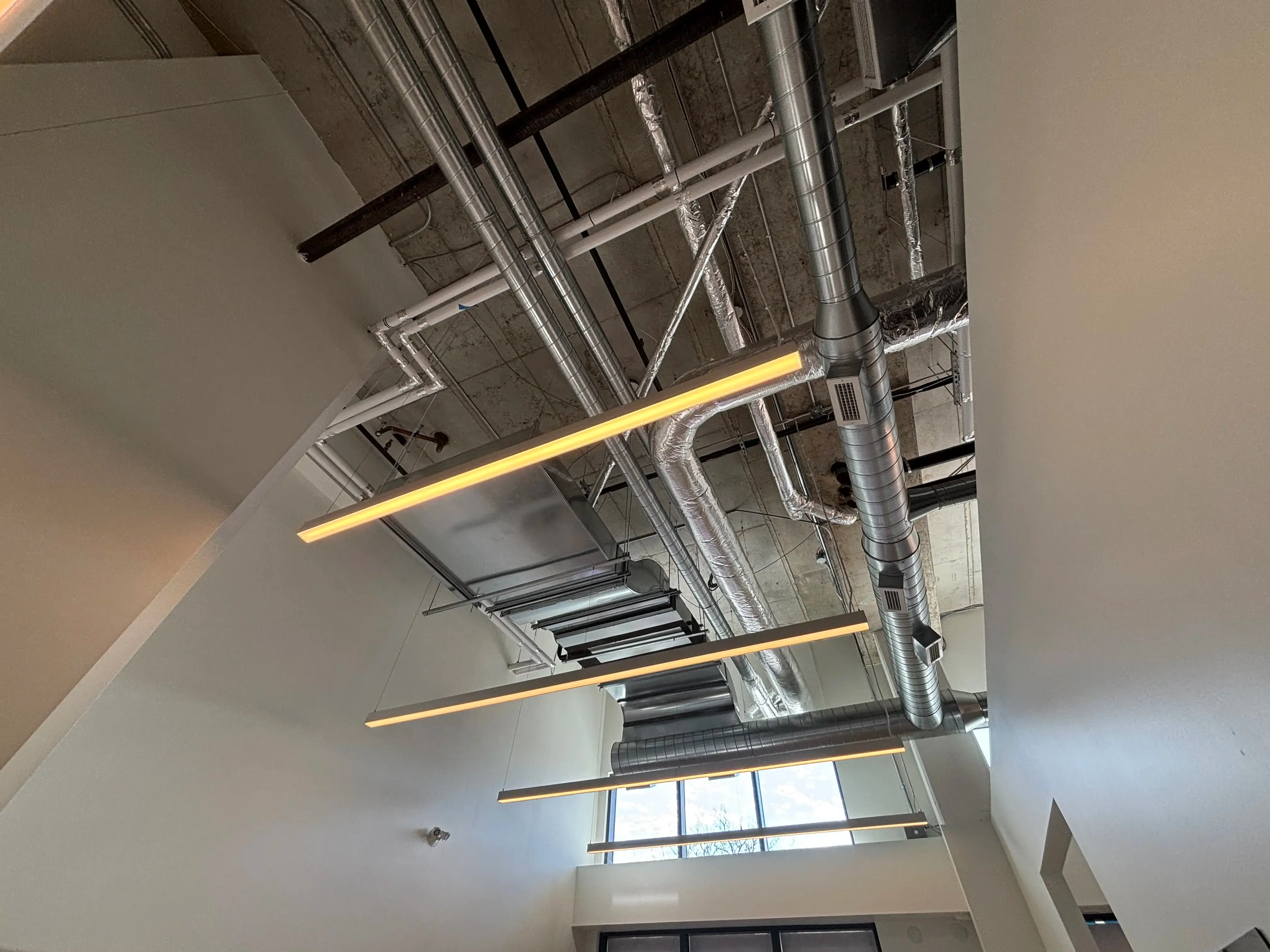 Commercial ceiling and duct work view from below